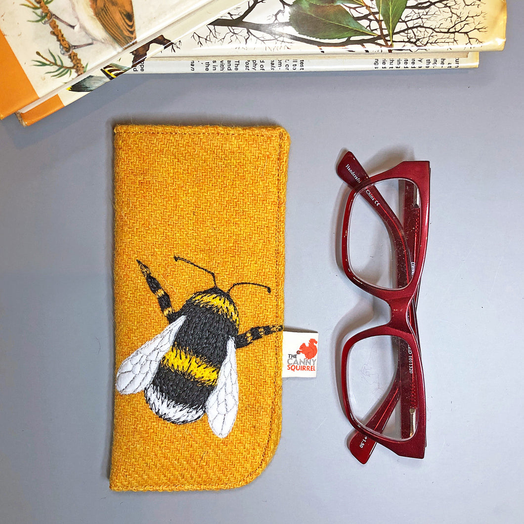 Yellow Harris Tweed glasses case with embroidered bee design